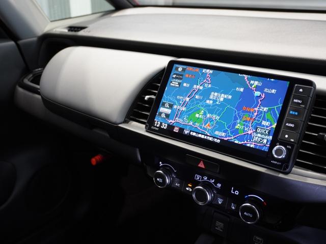 フィット ｅ：ＨＥＶＲＳ　当社デモカー　禁煙車　９インチギャザーズメモリーナビ　フルセグ　ＣＤ／ＤＶＤ　ミュージックラック　ホンダセンシング　ＬＥＤヘッドライト　ＥＴＣ　ドライブレコーダー　前後センサー１６インチアルミホイール（34枚目）