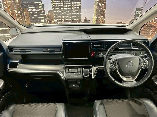 ステップワゴンスパーダ スパーダハイブリッドG・EXホンダセンシングブラスタ (禁煙車)(後期型)(黒半革シート)(後席モニター)(両側パワスラ)(純正ナビ)(バックカメラ)(レーダークルーズ)(シートヒーター)(ビルトインETC)(LEDヘッドライト)(純正16AW)(5枚目)