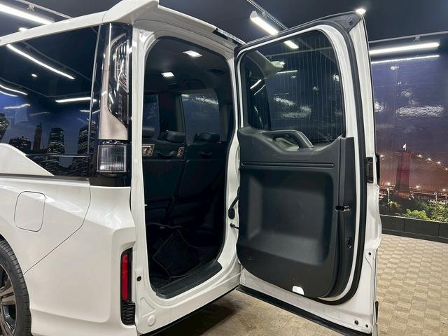 ステップワゴンスパーダ スパーダハイブリッドG・EXホンダセンシングブラスタ (禁煙車)(後期型)(黒半革シート)(後席モニター)(両側パワスラ)(純正ナビ)(バックカメラ)(レーダークルーズ)(シートヒーター)(ビルトインETC)(LEDヘッドライト)(純正16AW)(52枚目)