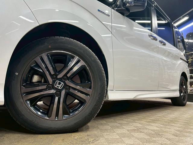 ステップワゴンスパーダ スパーダハイブリッドG・EXホンダセンシングブラスタ (禁煙車)(後期型)(黒半革シート)(後席モニター)(両側パワスラ)(純正ナビ)(バックカメラ)(レーダークルーズ)(シートヒーター)(ビルトインETC)(LEDヘッドライト)(純正16AW)(62枚目)