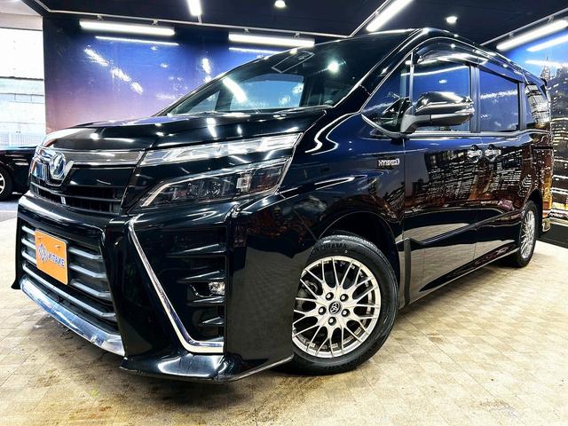 ヴォクシー ハイブリッドＺＳ　煌　（禁煙車）（後期型）（パワースライドドア）（純正ナビ）（ビルトインＥＴＣ）（クルーズコントロール）（シートヒーター）（両側スライドドア）（ウォークスルー）（ＬＥＤヘッドライト）（純正１６インチＡＷ）（28枚目）