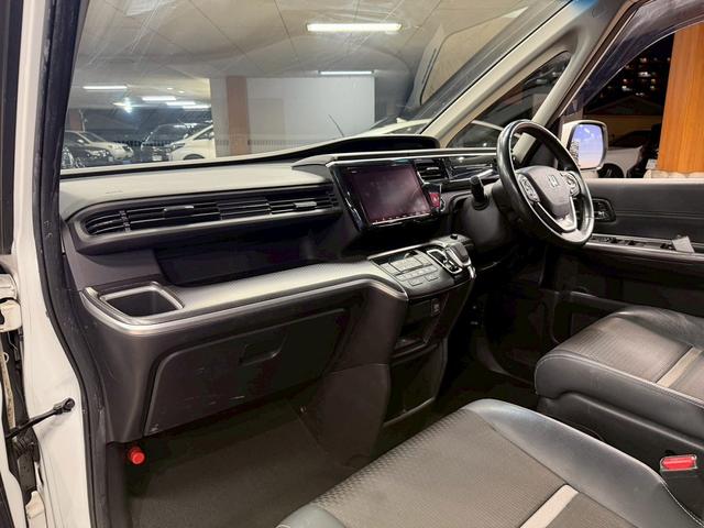 ステップワゴンスパーダ スパーダハイブリッド G・EX ホンダセンシング (後期型)(黒半革シート)(両側パワースライド)(純正メモリナビ)(全方位カメラ)(レーダークルーズ)(コーナーセンサー)(ビルトインETC)(電動パーキング)(シートヒーター)(純正16インチAW)(32枚目)