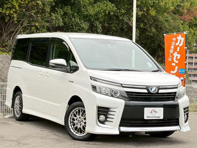 ヴォクシー ハイブリッドZS 禁煙車 純正10型ナビ フリップダウンモニター バックカメラ 前後ドラレコ 両側パワースライド ETC2.0 LEDヘッドライト 衝突軽減 レーンキープ Bluetooth 純正16AW 車検整備付(5枚目)