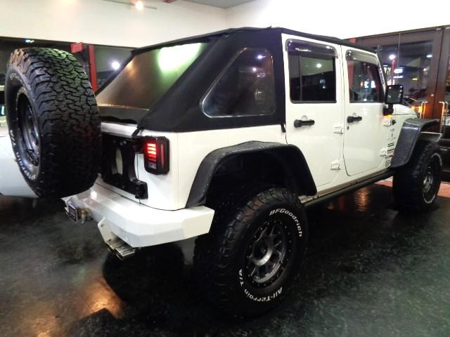 ジープ・ラングラーアンリミテッド スポーツ　３．８Ｖ６エンジンパートタイム４ＷＤ黒幌ＴＯＰオーバーフェンダＢＡＴＴＬＥＺマフラーリフトＵＰサスアイアンバンパー電動ウインチＸＤ１７アルミブロックタイヤ電動サイドステップＬＥＤライトＬＥＤフォグナビ（27枚目）