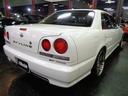 ＧＴ　Ｒ３４ＧＴ４ＤセダンボディＲＢ２０ＤＥＮＥＯ６エンジン純正５ＭＴミッション専用２本出しマフラーＢＬＩＴＺ車高調ＳＰＡＲＣＯアルミフルセグナビＴＶタイミングベルト交換済Ｒ３４ＧＴＲ仕様フルエアロ取り付け(3枚目)