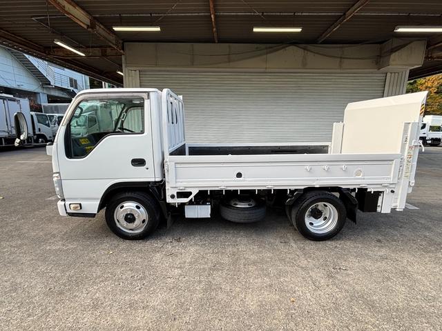 エルフトラック 2t 平ボディ 垂直パワーゲート パワーゲート 準中型 3方開 床鉄板張り ロープ通し穴 積載量2.000kg オートマ AT ショートボディ 10尺 4ナンバー ターボ車 新明和製 電動格納ミラー(25枚目)