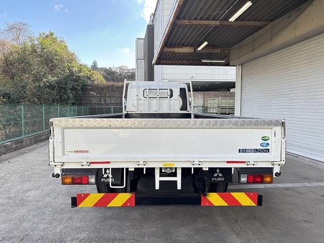 キャンター 　３ｔ　平ボディ　ワイドロング　超ロング　５ｍボディ　３方開　床木材張り　アルミ縞板被せ　デュオニック　ＡＴ　オートマ　２ペダル　ターボ車　３人乗り　坂道補助装置　電動格納ミラー　積載量４．２５０ｋｇ（6枚目）