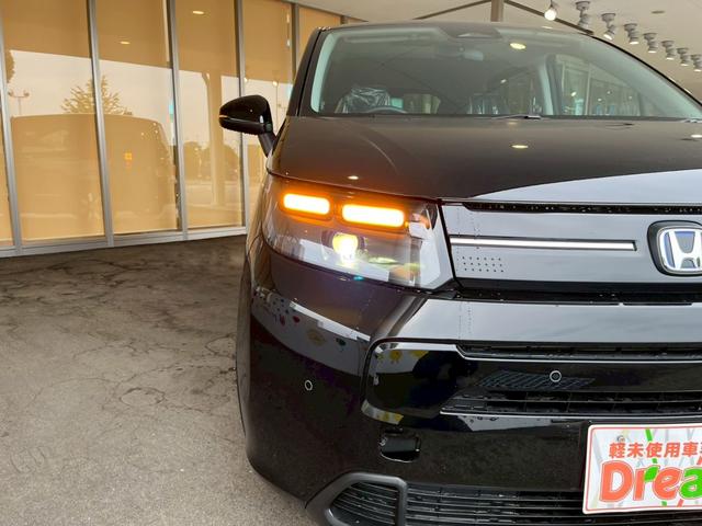 フリード e:HEVエアー EX 登録済未使用車 両側電動スライドドア HondaSENSING 純正アルミホイール アダプティブクルーズコントロール 禁煙車 電子パーキング オートブレーキホールド シートヒーター 電動格納式ミラー(18枚目)