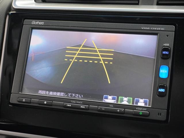 フィットハイブリッド Ｆパッケージコンフォートエディション　１年保証ナビＤレコＲカメＥＴＣ地デジＢＴ接続　地デジフルセグ　セキュリティアラーム　ナビＴＶ　リアカメラ　ＥＴＣ車載器　ドラレコ　エアコン　スマートキー　メモリーナビ　１オ－ナ－　アイドリングストップ（3枚目）