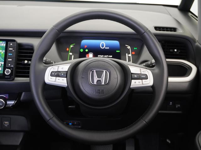 フィット e:HEVホーム 2年保証ナビRカメETCクルコンBT地デジ 前後誤発進抑制機能 クリソナ 助手席エアバッグ 運転席エアバッグ 1オナ アイドリングストップ 禁煙 LEDライト バックカメラ ABS サイドエアバッグ(7枚目)