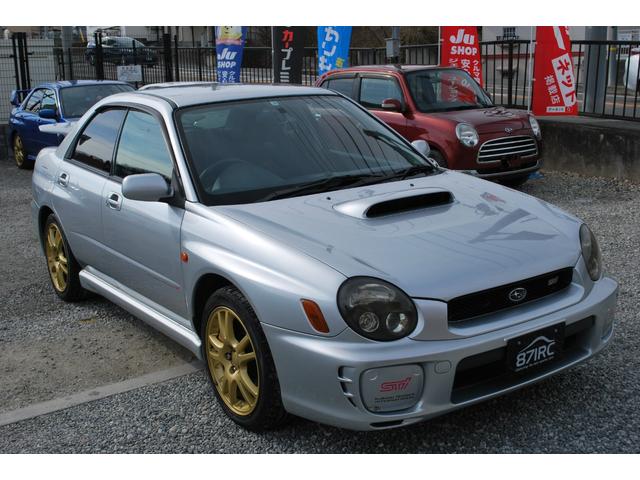 インプレッサ ＷＲＸ　ＳＴｉリミテッド　修復歴無　フルオリジナルコンディション　キセノン　純正１７アルミ　純正ブレンボ　Ｒスポイラー　キーレス　純正ＭＯＭＯステアリング　整備記録簿有り　保証書　取説　専用スポーツシート（16枚目）