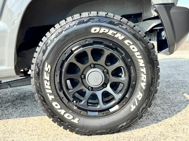 ジムニー ＸＣ　ワンオーナー　カスタム使用（キャリア・１６インチブロックタイヤ）　デュアルセンサーブレーキサポート　ドラレコ　シートヒーター　レーンキープアシスト　Ｐスタート　後席シートベルトリマインダー　背面タイヤ（28枚目）