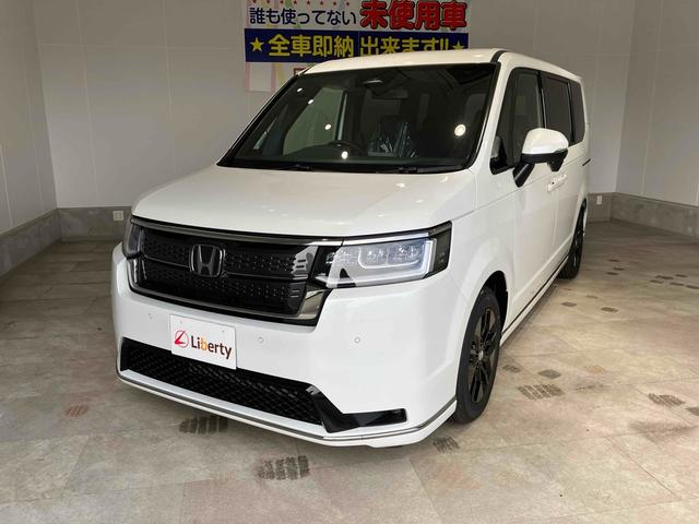 ステップワゴン スパーダ HondaSENSING 両側電動スライドドア 追従型クルーズコントロール 純正アルミホイール 電動リアゲート 電子パーキング オートブレーキホールド シートヒーター 後席エアコン 2列目オットマン(6枚目)