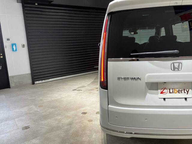 ステップワゴン スパーダ HondaSENSING 両側電動スライドドア 追従型クルーズコントロール 純正アルミホイール 電動リアゲート 電子パーキング オートブレーキホールド シートヒーター 後席エアコン 2列目オットマン(18枚目)