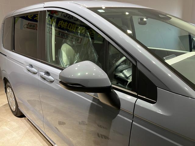 フリード ｅ：ＨＥＶエアー　届出済未使用車　クリアランスソナー　オートクルーズコントロール　レーンアシスト　衝突被害軽減システム　両側電動スライドドア　オートライト　ＬＥＤヘッドランプ　スマートキー　アイドリングストップ（16枚目）