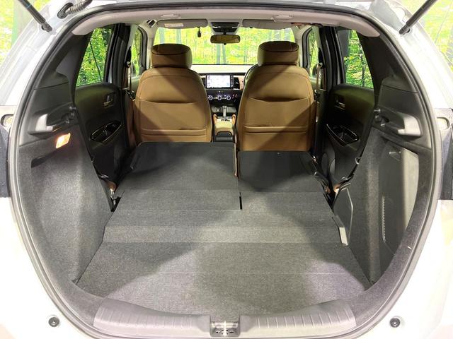 フィット ｅ：ＨＥＶリュクス　純正９型ナビ　バックカメラ　アダプティブクルーズコントロール　シートヒーター　コーナーセンサー　ハーフレザーシート　禁煙　革巻ステアリング　ＬＥＤヘッドライト　Ｂｌｕｅｔｏｏｔｈ　置くだけ充電（10枚目）