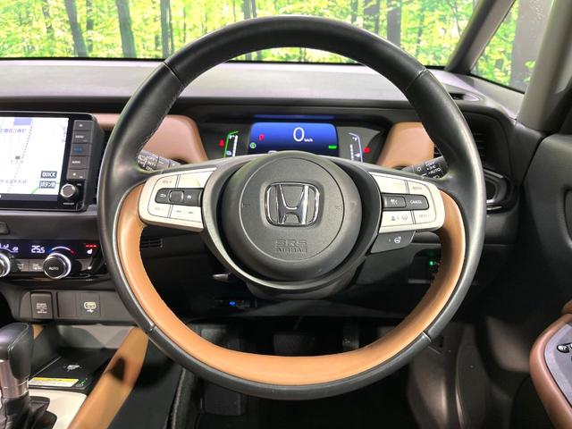 フィット ｅ：ＨＥＶリュクス　純正９型ナビ　バックカメラ　アダプティブクルーズコントロール　シートヒーター　コーナーセンサー　ハーフレザーシート　禁煙　革巻ステアリング　ＬＥＤヘッドライト　Ｂｌｕｅｔｏｏｔｈ　置くだけ充電（11枚目）