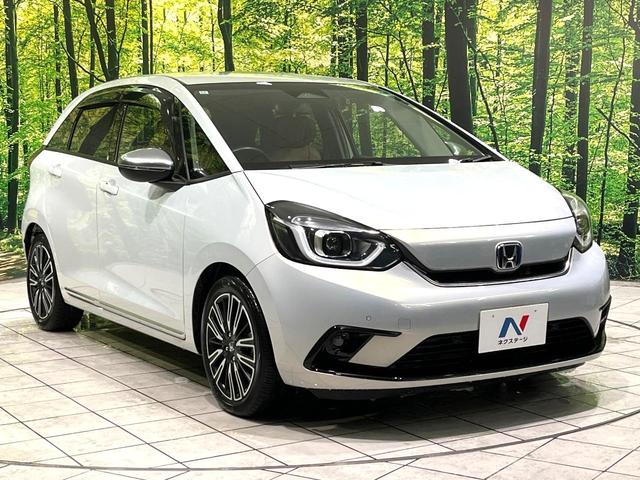 フィット ｅ：ＨＥＶリュクス　純正９型ナビ　バックカメラ　アダプティブクルーズコントロール　シートヒーター　コーナーセンサー　ハーフレザーシート　禁煙　革巻ステアリング　ＬＥＤヘッドライト　Ｂｌｕｅｔｏｏｔｈ　置くだけ充電（16枚目）