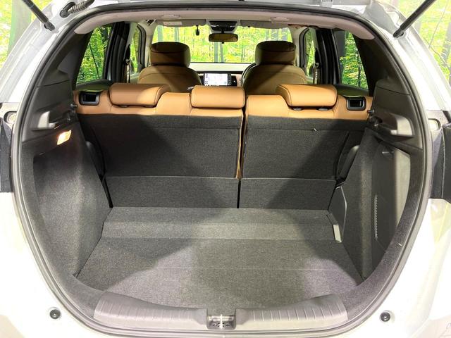 フィット ｅ：ＨＥＶリュクス　純正９型ナビ　バックカメラ　アダプティブクルーズコントロール　シートヒーター　コーナーセンサー　ハーフレザーシート　禁煙　革巻ステアリング　ＬＥＤヘッドライト　Ｂｌｕｅｔｏｏｔｈ　置くだけ充電（53枚目）