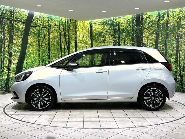 フィット ｅ：ＨＥＶリュクス　純正９型ナビ　バックカメラ　アダプティブクルーズコントロール　シートヒーター　コーナーセンサー　ハーフレザーシート　禁煙　革巻ステアリング　ＬＥＤヘッドライト　Ｂｌｕｅｔｏｏｔｈ　置くだけ充電（55枚目）