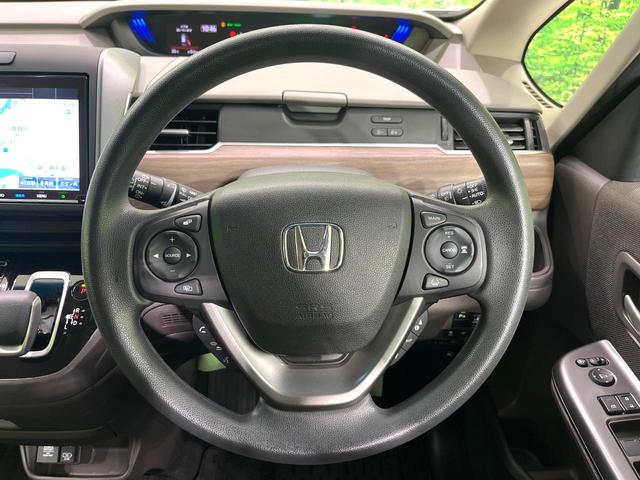 フリードハイブリッド ハイブリッド・Ｇホンダセンシング　純正９型ナビ　バックカメラ　両側電動スライドドア　前席シートヒーター　アダプティブクルーズコントロール　スマートキー　ＬＥＤヘッド＆フォグランプ　ＥＴＣ　ドライブレコーダー　アイドリングストップ（12枚目）