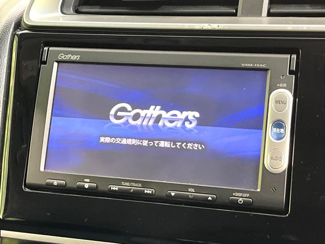 フィット 13G・Lパッケージ 純正ナビ バックカメラ ETC LEDヘッド アイドリングストップ オートエアコン オートライト ステアリングスイッチ スマートキー 電動格納ミラー パワーウィンドウ プライバシーガラス 禁煙車(3枚目)