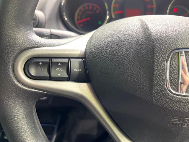 フィット １３Ｇ・スマートセレクション　ファインスタイル　純正ナビ　バックカメラ　スマートキー　ＨＩＤヘッドライト　ビルトインＥＴＣ　ドライブレコーダー　１４インチアルミホイール　オートライト　オートエアコン　ＣＤ　ＴＶ　電動格納ミラー　禁煙（50枚目）