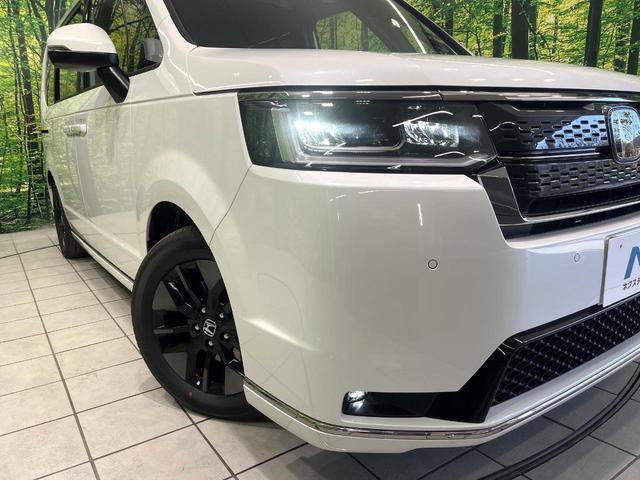 ステップワゴン ｅ：ＨＥＶスパーダ　登録済未使用車　純正１１．４型ナビ　バックカメラ　両側電動スライドドア　ホンダセンシング　パワーバックドア　ブラインドスポットモニター　前席シートヒーター　電動パーキングブレーキ（13枚目）