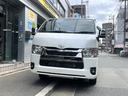 ハイエースバン スーパーGL ダークプライムII 登録済未使用車・パノラミックビューモニター・特別仕様車・LEDヘッドライト・メッキフロントグリル・黒木目加飾・スライドドアスカッフプレート・AC100V・トヨタセーフティセンス 中古車画像_2