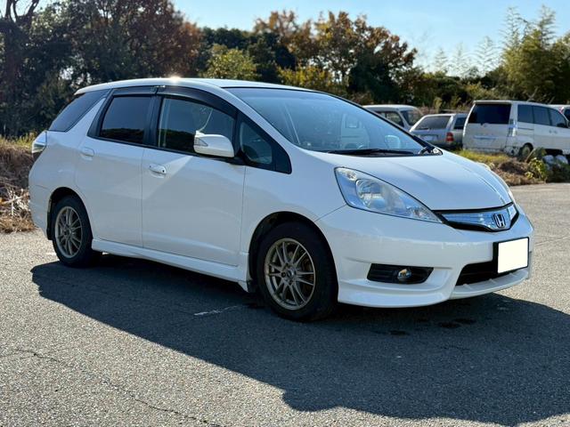 フィットシャトルハイブリッド ハイブリッド・スマートセレクション ユーザー様買取車 ナビ VSA ABS+TCS+横すべり抑制 HID アイドリングストップ 衝突安全ボディ 盗難防止システム スマートキー ECONモード オートクルーズコントロール オートエアコン(7枚目)