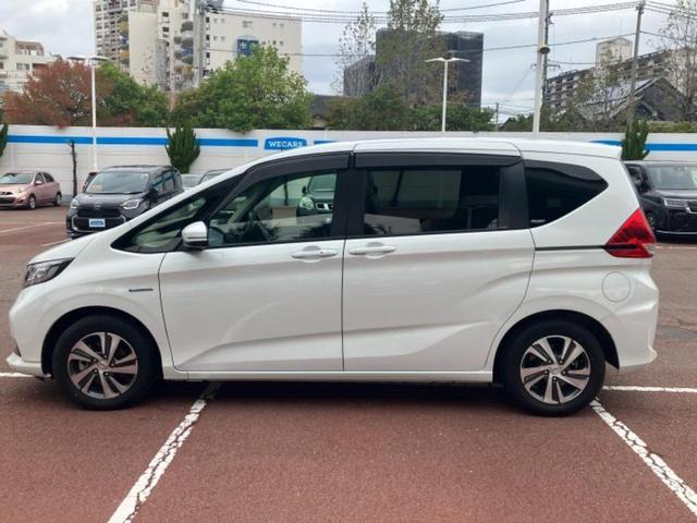 フリードハイブリッド ハイブリッドGホンダセンシング 純正 9インチ ナビ/フリップダウンモニター 純正 9インチ/衝突安全装置/両側電動スライドドア/シートヒーター 前席/車線逸脱防止支援システム/ヘッドランプ LED/ETC/EBD付ABS(2枚目)