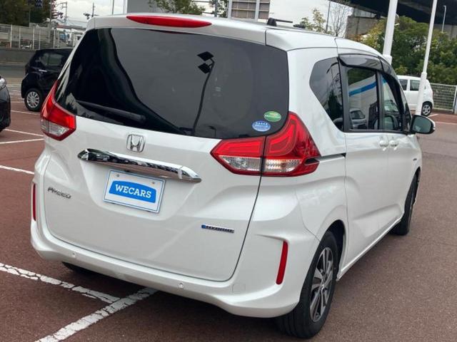 フリードハイブリッド ハイブリッドGホンダセンシング 純正 9インチ ナビ/フリップダウンモニター 純正 9インチ/衝突安全装置/両側電動スライドドア/シートヒーター 前席/車線逸脱防止支援システム/ヘッドランプ LED/ETC/EBD付ABS(3枚目)