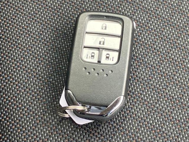 フリードハイブリッド ハイブリッドGホンダセンシング 純正 9インチ ナビ/フリップダウンモニター 純正 9インチ/衝突安全装置/両側電動スライドドア/シートヒーター 前席/車線逸脱防止支援システム/ヘッドランプ LED/ETC/EBD付ABS(30枚目)