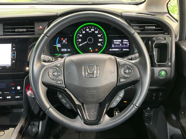 シャトル ハイブリッドＺ　ホンダセンシング　純正ＳＤナビ　バックカメラ　ホンダセンシング　アダプティブクルーズコントロール　シートヒーター　ＥＴＣ　ドライブレコーダー　Ｂｌｕｅｔｏｏｔｈ接続　電動格納ミラー　オートエアコン　オートライト（11枚目）