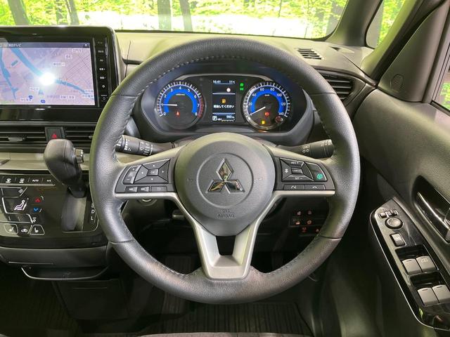 デリカミニ Ｇ　プレミアム　リミテッドエディション　両側電動ドア　純正９型ナビ　全周囲カメラ　衝突被害軽減システム　禁煙車　ハーフレザーシート　コーナーセンサ　スマートキー　ＬＥＤヘッド　ルーフレール　純正１５インチアルミ　オートライト　オートエアコン（11枚目）