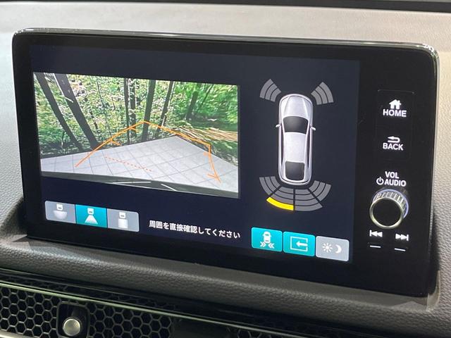シビック ｅ：ＨＥＶ　純正９型ナビ　テールゲートスポイラー　バックカメラ　ＢＯＳＥサウンド　衝突被害軽減システム　レーダークルーズ　禁煙車　ハーフレザーシート　コーナーセンサー　スマートキー　ＬＥＤヘッド　ＥＴＣ２．０（5枚目）