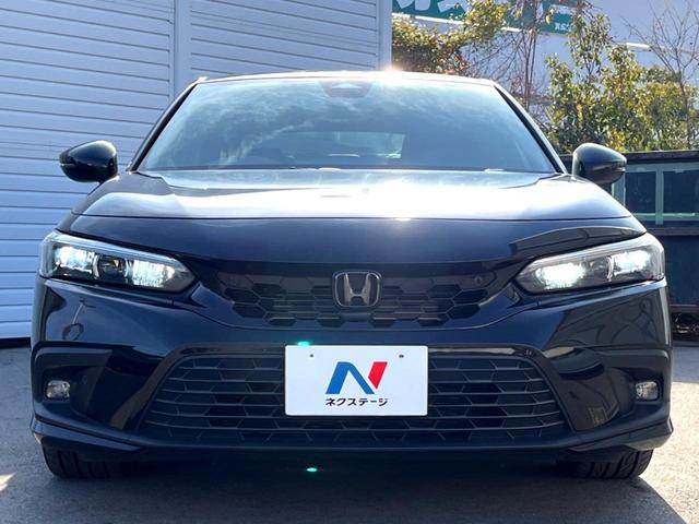 シビック ｅ：ＨＥＶ　ホンダセンシング　テールゲートスポイラー　ＢＯＳＥ　ホンダコネクトディスプレイ　バックカメラ　ハーフレザー　パワーシート　シートヒーター　ＬＥＤヘッド　純正１８インチＡＷ　革巻きステアリング　禁煙車（16枚目）