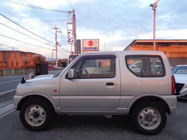 ジムニー ＸＧ　１年走行距離無制限保証付／パートタイム４ＷＤ／ＦＭラジオ／ＡＭラジオ／ＣＤ／フェンダーミラー／背面タイヤ／キーレス／前席パワーウィンドウスイッチ／フロア４速オートマ／エアコン／運転席・助手席エアバック（5枚目）