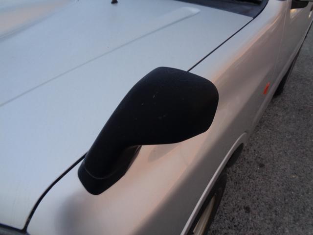 ジムニー ＸＧ　１年走行距離無制限保証付／パートタイム４ＷＤ／ＦＭラジオ／ＡＭラジオ／ＣＤ／フェンダーミラー／背面タイヤ／キーレス／前席パワーウィンドウスイッチ／フロア４速オートマ／エアコン／運転席・助手席エアバック（26枚目）