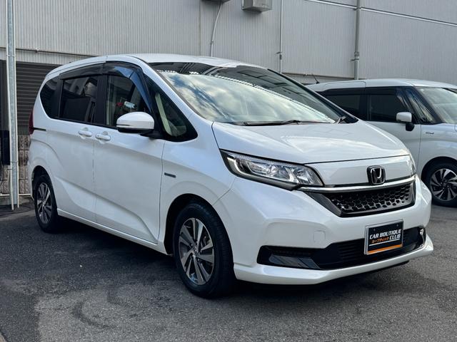 フリードハイブリッド ハイブリッド・Gホンダセンシング ワンオーナー Gathers純正ナビ フルセグTV バックカメラ シートヒーター リアソナー 禁煙 純正ドライブレコーダー  オートLEDヘッドライト 両側電動スライドドア 記録簿4枚 ETC(4枚目)