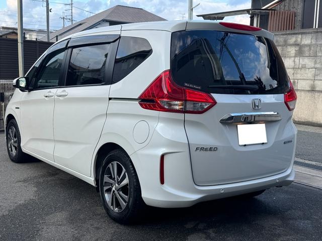 フリードハイブリッド ハイブリッド・Gホンダセンシング ワンオーナー Gathers純正ナビ フルセグTV バックカメラ シートヒーター リアソナー 禁煙 純正ドライブレコーダー  オートLEDヘッドライト 両側電動スライドドア 記録簿4枚 ETC(6枚目)