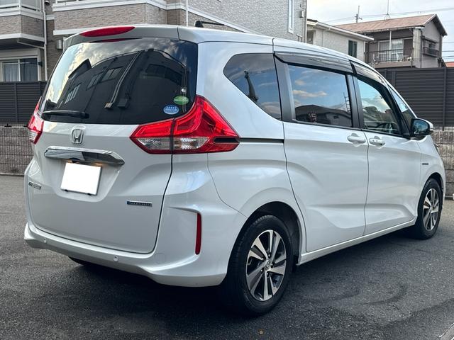 フリードハイブリッド ハイブリッド・Gホンダセンシング ワンオーナー Gathers純正ナビ フルセグTV バックカメラ シートヒーター リアソナー 禁煙 純正ドライブレコーダー  オートLEDヘッドライト 両側電動スライドドア 記録簿4枚 ETC(7枚目)