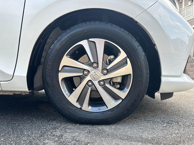 フリードハイブリッド ハイブリッド・Gホンダセンシング ワンオーナー Gathers純正ナビ フルセグTV バックカメラ シートヒーター リアソナー 禁煙 純正ドライブレコーダー  オートLEDヘッドライト 両側電動スライドドア 記録簿4枚 ETC(12枚目)