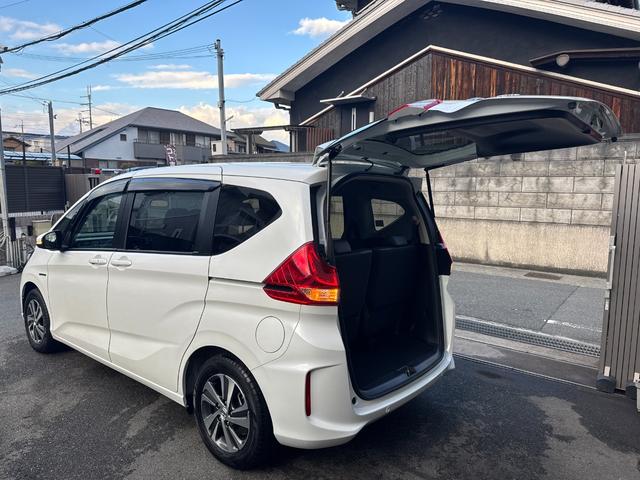 フリードハイブリッド ハイブリッド・Gホンダセンシング ワンオーナー Gathers純正ナビ フルセグTV バックカメラ シートヒーター リアソナー 禁煙 純正ドライブレコーダー  オートLEDヘッドライト 両側電動スライドドア 記録簿4枚 ETC(31枚目)