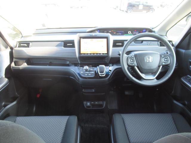 フリードハイブリッド ハイブリッド・Ｇブラックスタイル　ギャザズ９インチナビ　Ｂｌｕｅｔｏｏｔｈ　ＣＤ・ＤＶＤ再生　バックカメラ　前後ドラレコ　両側電動スライド　シートヒーター　後席モニター　モデューロエアロ　純正アルミホイール　ロールサンシェード（5枚目）