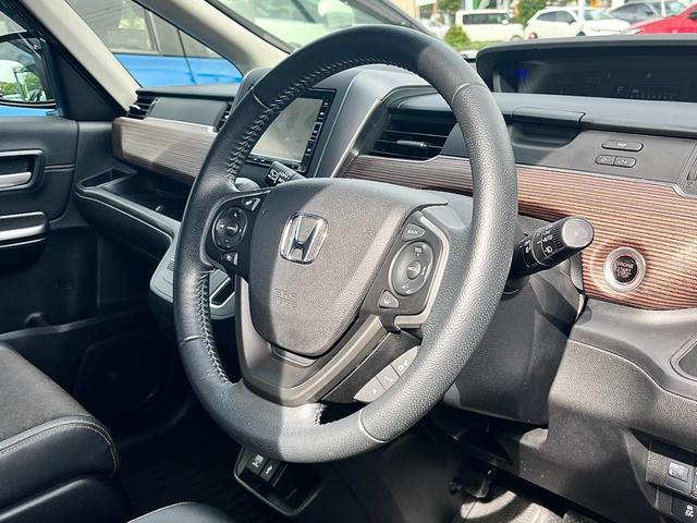 フリード クロスター・ホンダセンシング 両側パワースライド 踏み間違い加速抑制 ディーラー保証1年付き走行距離無制限 ナビ フルセグ バックカメラ CD再生 ETC スマートキー 純正アルミホイール ワンオーナー(35枚目)