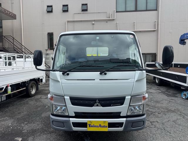 キャンター AT 2トン 全低床平ボディ パワーゲート 荷台板張 パワーゲート新明和 垂直パワーゲート リモコン 全席シートカバー付き 荷台ゴムマット 走行15.000キロ台 5t限定中型免許 車両重量2550kg 車両総重量4715kg 荷寸347×179×38(7枚目)