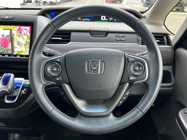 フリード＋ハイブリッド ハイブリッドＥＸ　新品タイヤ／保証書／純正　９インチ　ＳＤナビ／ホンダセンシング／両側電動スライドドア／シートヒーター　前席／車線逸脱防止支援システム／シート　ハーフレザー／パーキングアシスト　バックガイド　ＤＶＤ再生（15枚目）