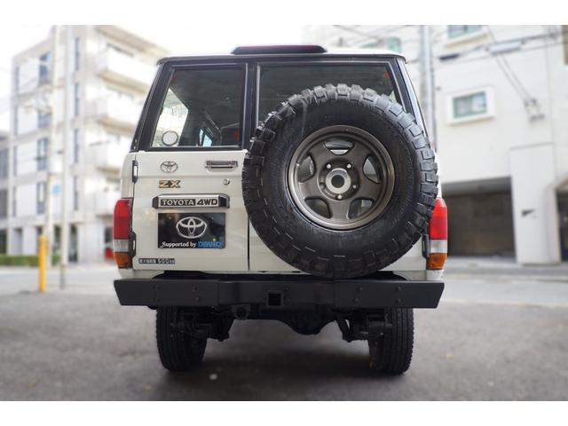 ランドクルーザー70 ZX ワンオーナー チルト&スライディングサンルーフ デフロック 背面スペアタイヤ サイドステップ パワーステアリング パワーウインドー 集中ドアロック チップアップシート マニュアルエアコン リアヒーター(6枚目)