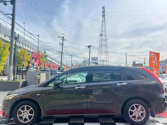 ストリーム X特別仕様車 HDDナビエディション HDDインターナビ バックカメラ ETC デジタルインナーミラー 3列シート 7人乗り スマートキー ステアリングスイッチ オートライト 社外15インチアルミ 電格ミラー HIDヘッドライト(12枚目)